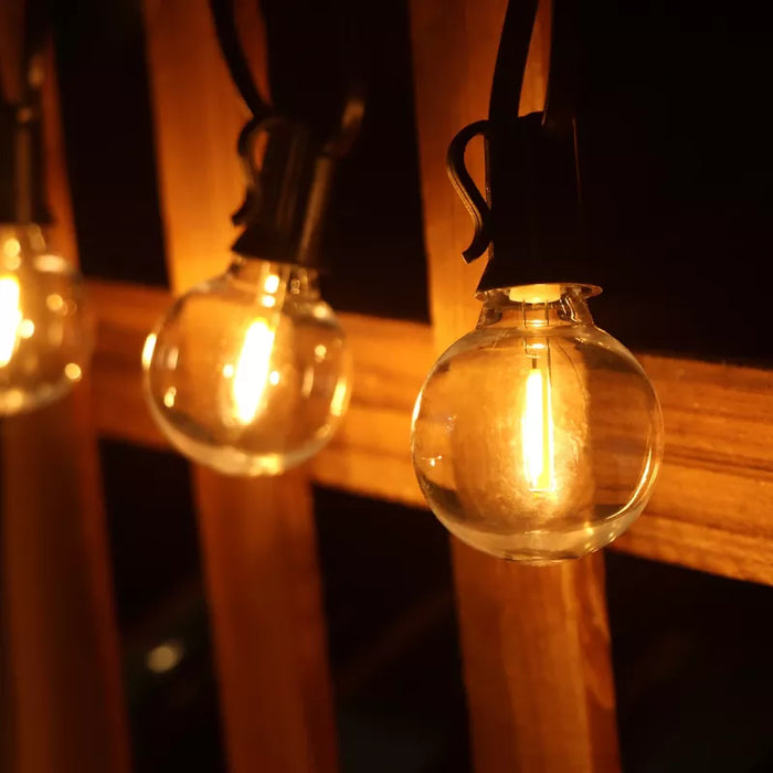 Guirlande lumineuse filaire de 36 ampoules - Série GUINGUETTE - Culot E12 - 25 Watts - 75 Lumens - Angle 360° - IP44 - 22 mètres - Couleur NOIR - Avec télécommande - 2700K