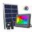 Projecteur LED solaire - Série WARRIOR RGBW (Multicolores + Blanc) - 500 Watts - Angle 120° - Lampe 38,5 x 30,3 x 8 cm - IP67 - Avec télécommande - Avec capteur crépusculaire - Bluetooth - Rythme musical - Panneau solaire inclus
