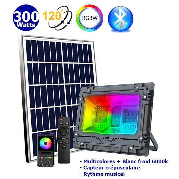 Projecteur LED solaire - Série WARRIOR RGBW (Multicolores + Blanc) - 300 Watts - Angle 120° - Lampe 34 x 27 x 8 cm - Panneau solaire 58 x 35 cm - IP67 - Avec télécommande - Avec capteur crépusculaire - Bluetooth - Rythme musical - Panneau solaire inclus